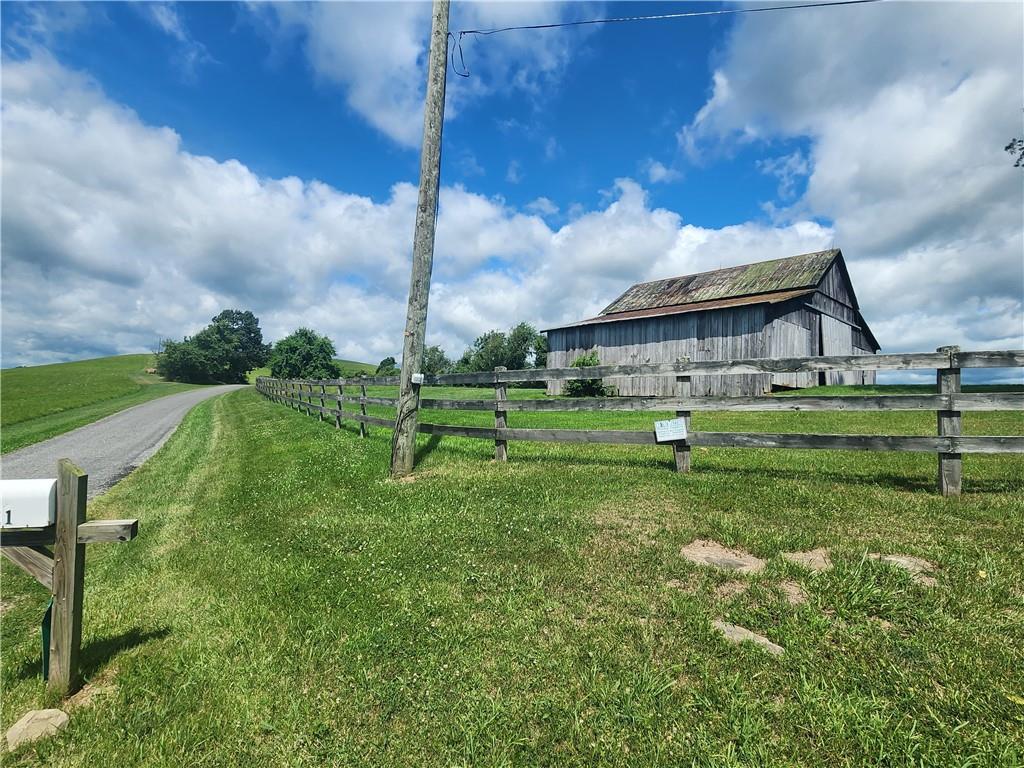 321 Chambers Ridge Road West Alexander, PA 15376 - Photo 28 of 42 a front view of a house with a yard