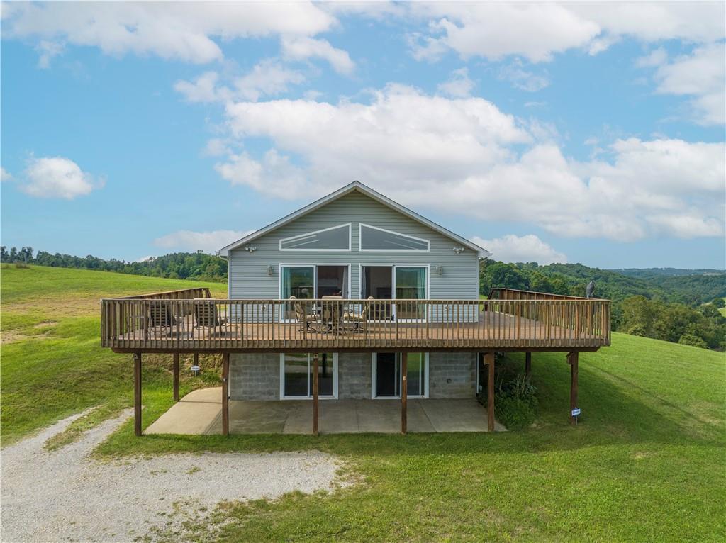 321 Chambers Ridge Road West Alexander, PA 15376 - Photo 3 of 42 a view of a house with a yard and sitting area