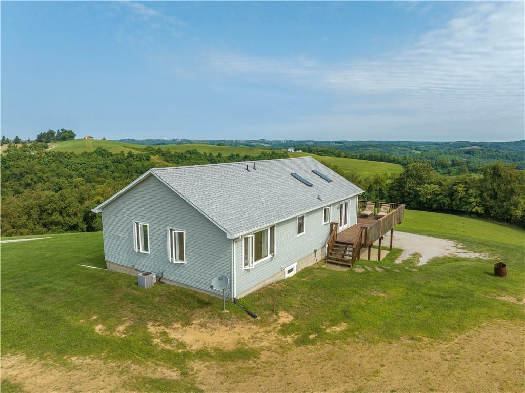 321 Chambers Ridge Road West Alexander, PA 15376 - Photo 38 of 42 a aerial view of a house with a yard table and chairs