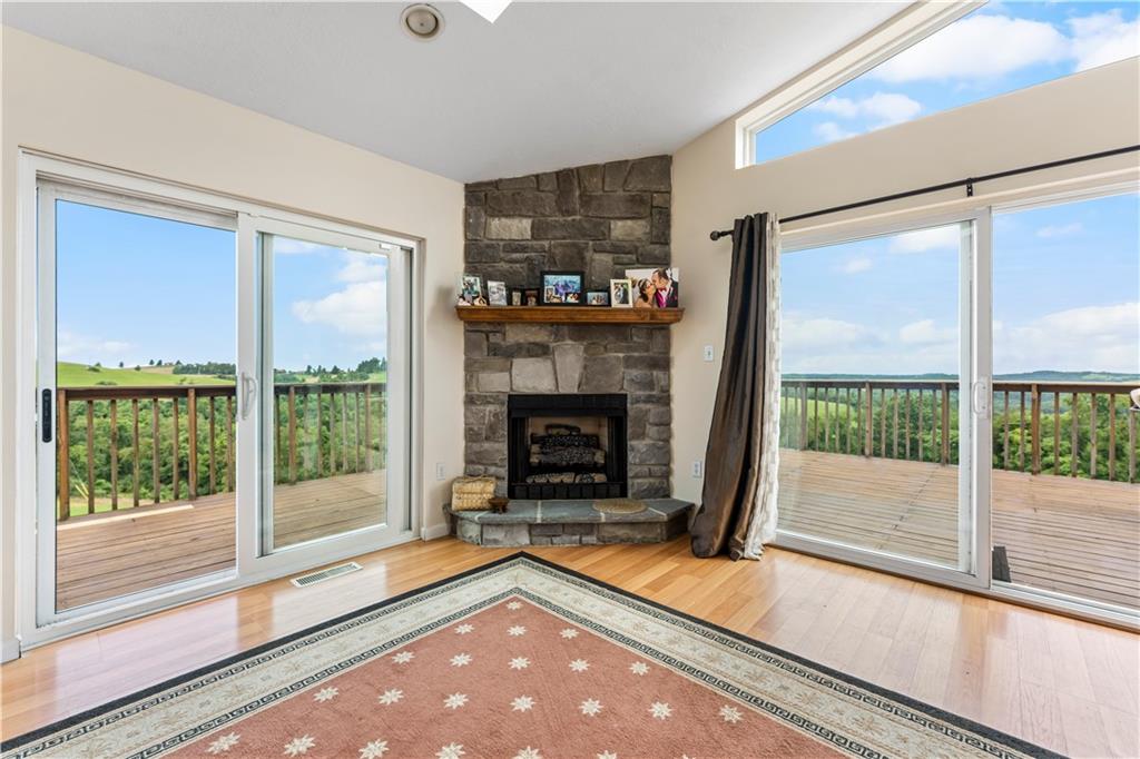 321 Chambers Ridge Road West Alexander, PA 15376 - Photo 9 of 42 a living room with fireplace furniture and a large window