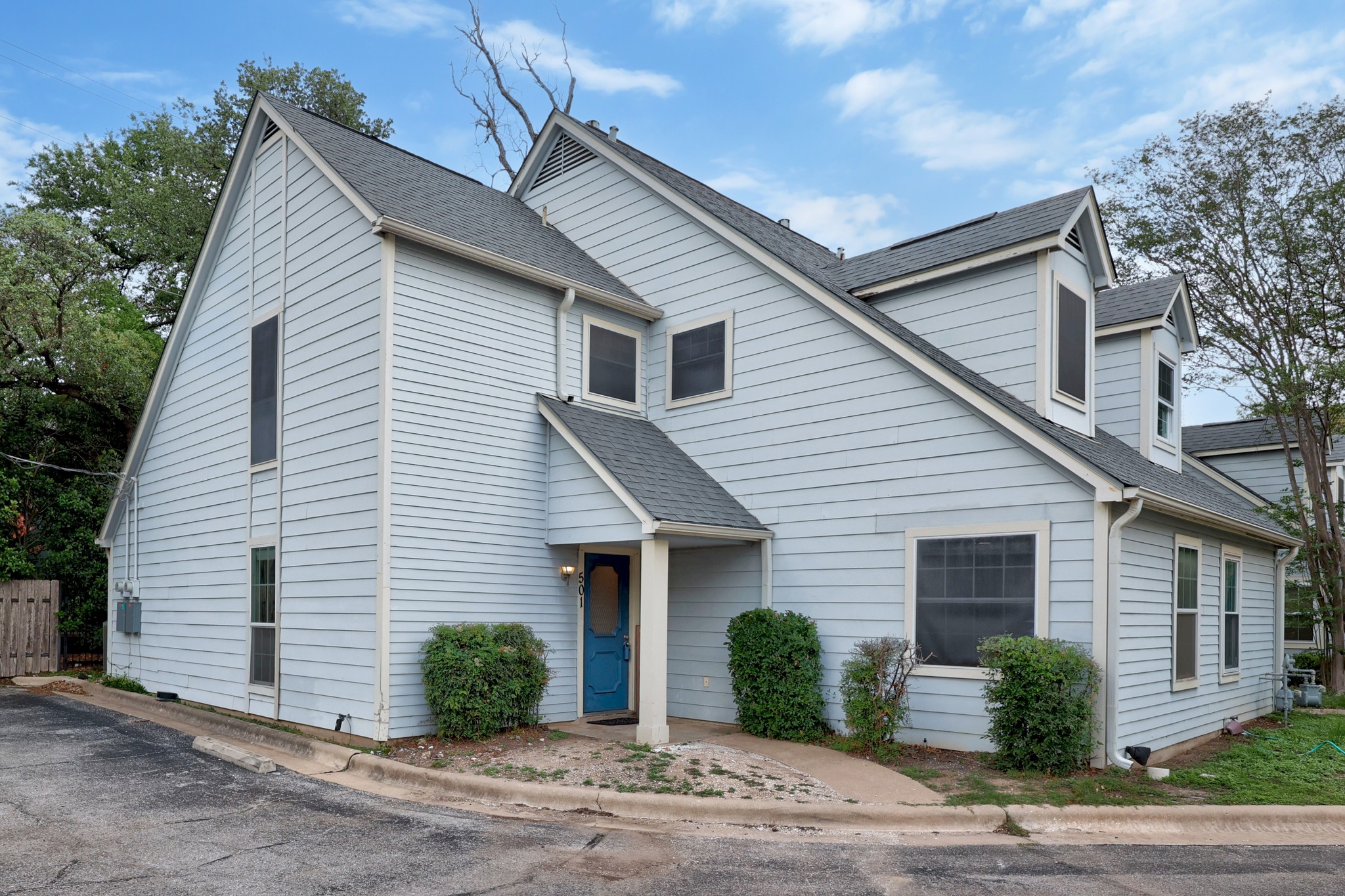 8330 Fathom Circle, Unit 501 Austin, TX 78750 - Photo 24 of 26 a view of a house with a yard and plants
