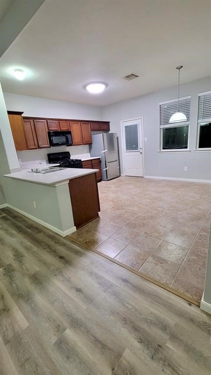 23614 Maple View Drive Spring, TX 77373 - Photo 13 of 23 a living room with stainless steel appliances kitchen island a refrigerator and a stove top oven