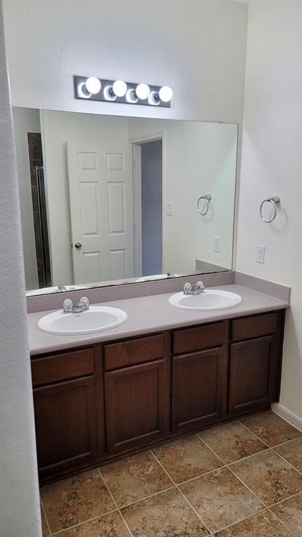 23614 Maple View Drive Spring, TX 77373 - Photo 15 of 23 a bathroom with a double vanity sink and a mirror