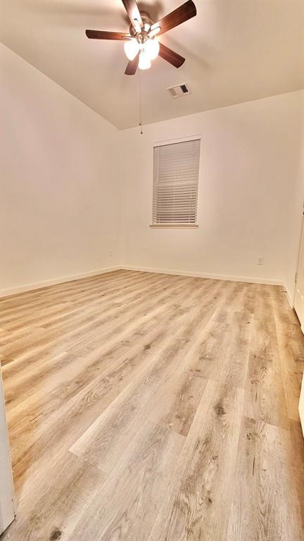 23614 Maple View Drive Spring, TX 77373 - Photo 18 of 23 an empty room with wooden floor fan and windows