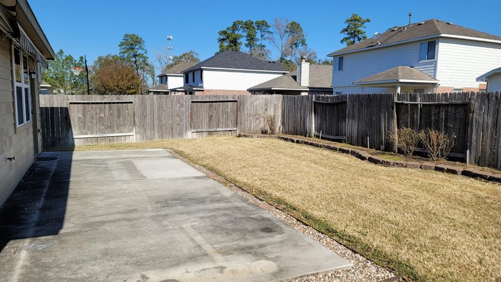 23614 Maple View Drive Spring, TX 77373 - Photo 21 of 23 a view of a house with a wooden fence