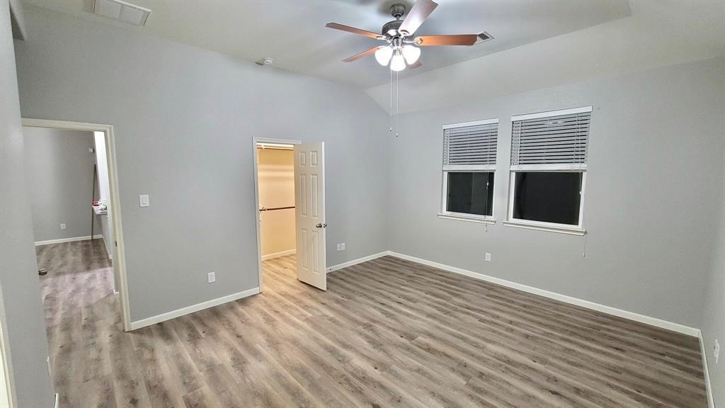 23614 Maple View Drive Spring, TX 77373 - Photo 7 of 23 a view of empty room with wooden floor and fan