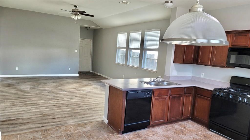 23614 Maple View Drive Spring, TX 77373 - Photo 10 of 23 a kitchen with stainless steel appliances granite countertop a sink stove and cabinets
