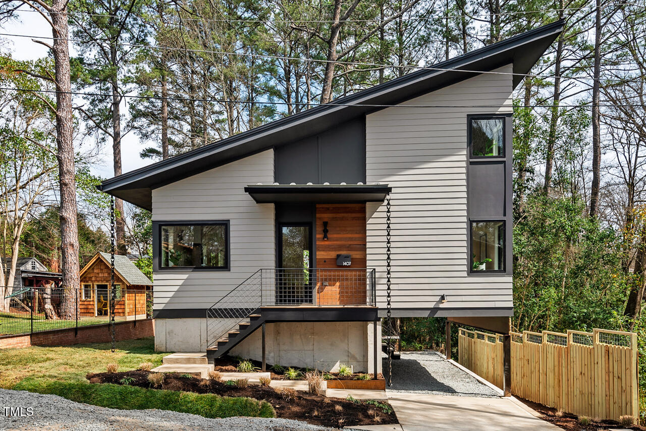 1407 Carroll Street Durham, NC 27707 - Photo 1 of 48 a front view of a house with garden