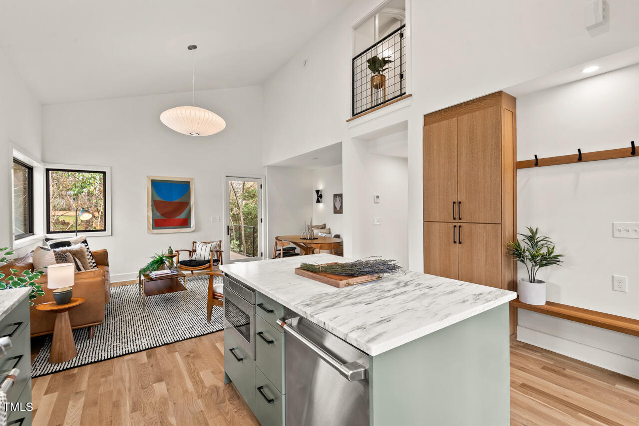 1407 Carroll Street Durham, NC 27707 - Photo 12 of 48 a kitchen with a stove and a wooden floor
