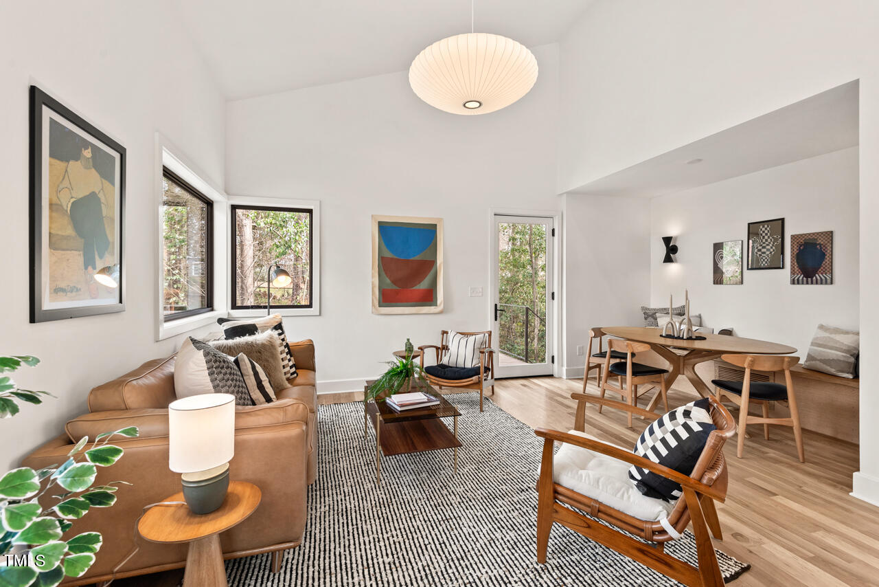1407 Carroll Street Durham, NC 27707 - Photo 14 of 48 a living room with furniture a wooden floor and next to a window