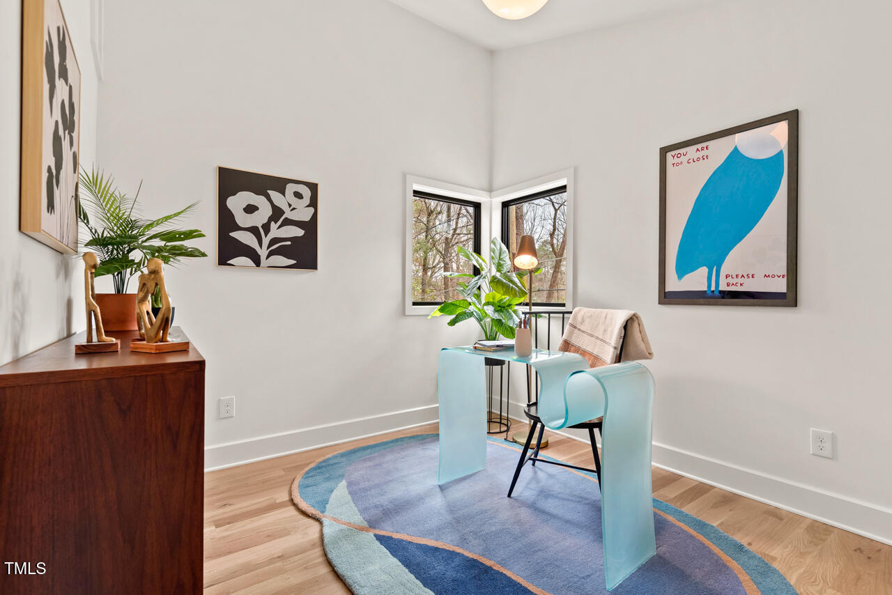 1407 Carroll Street Durham, NC 27707 - Photo 35 of 48 a workspace room with furniture and wooden floor