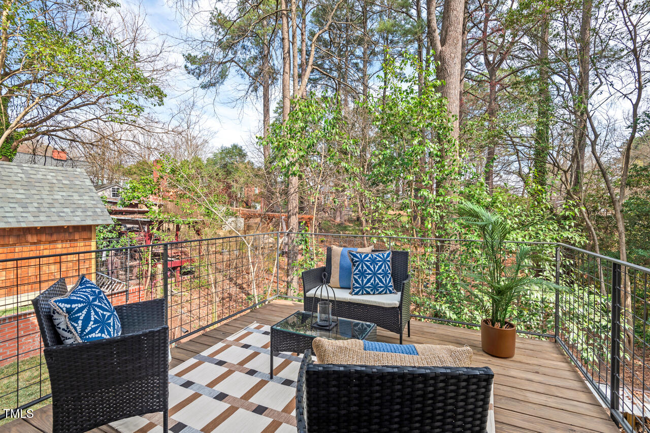 1407 Carroll Street Durham, NC 27707 - Photo 39 of 48 a view of a chairs and table on the wooden floor