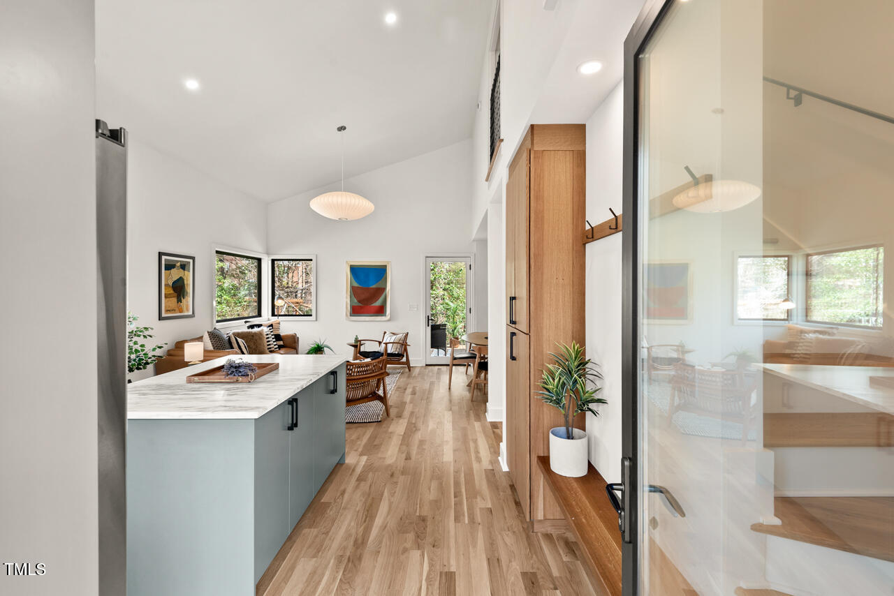 1407 Carroll Street Durham, NC 27707 - Photo 3 of 48 a large kitchen with a lot of counter space and a wooden floor