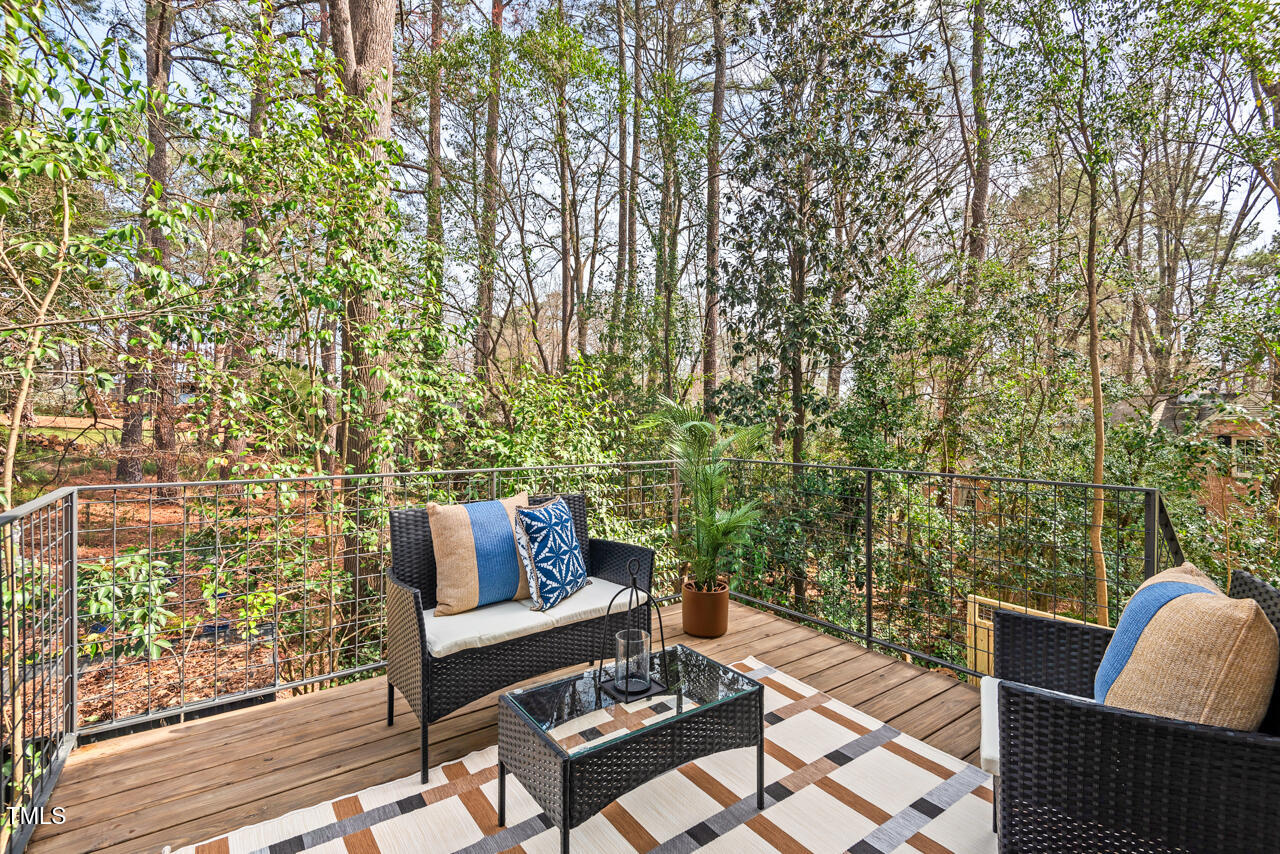 1407 Carroll Street Durham, NC 27707 - Photo 40 of 48 a roof deck with couches and wooden floor