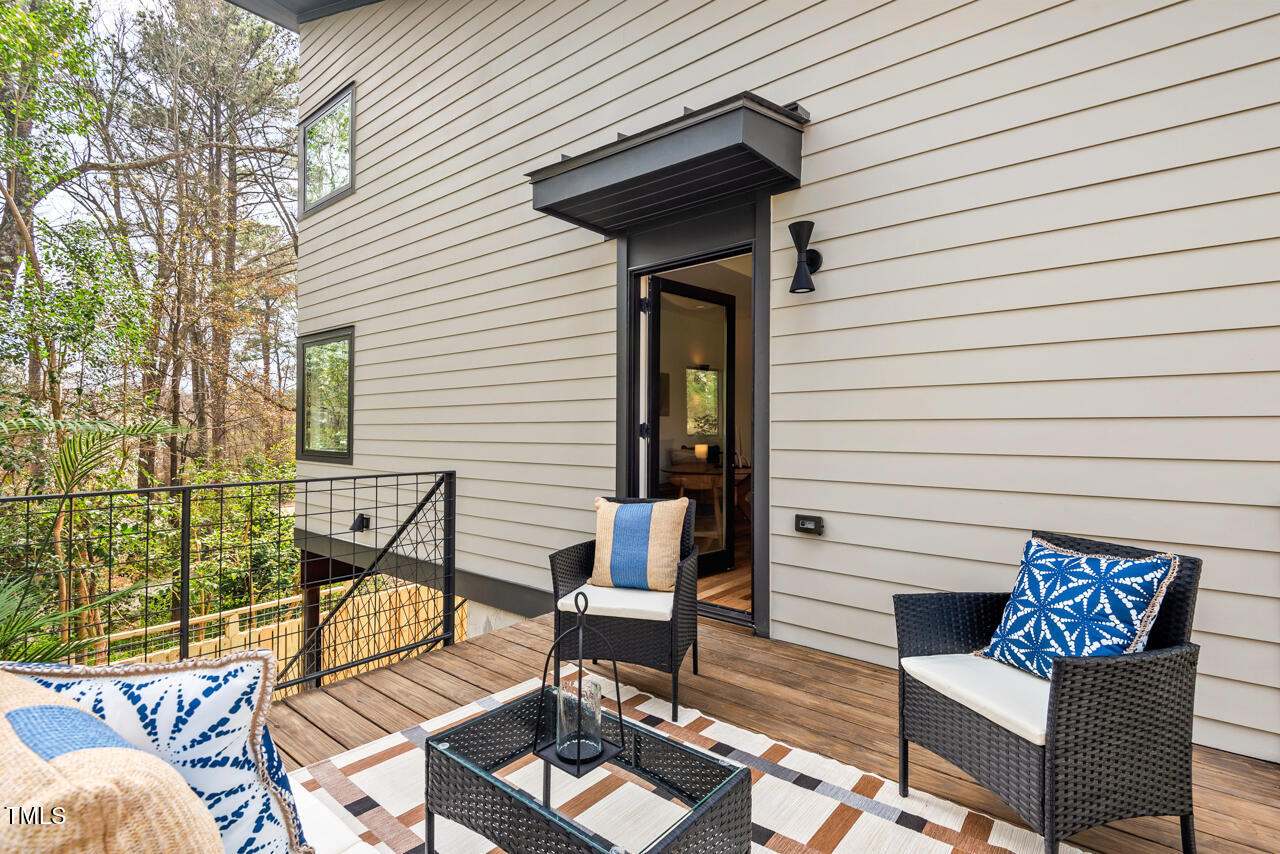 1407 Carroll Street Durham, NC 27707 - Photo 42 of 48 a view of a chairs and table in the back yard of the house