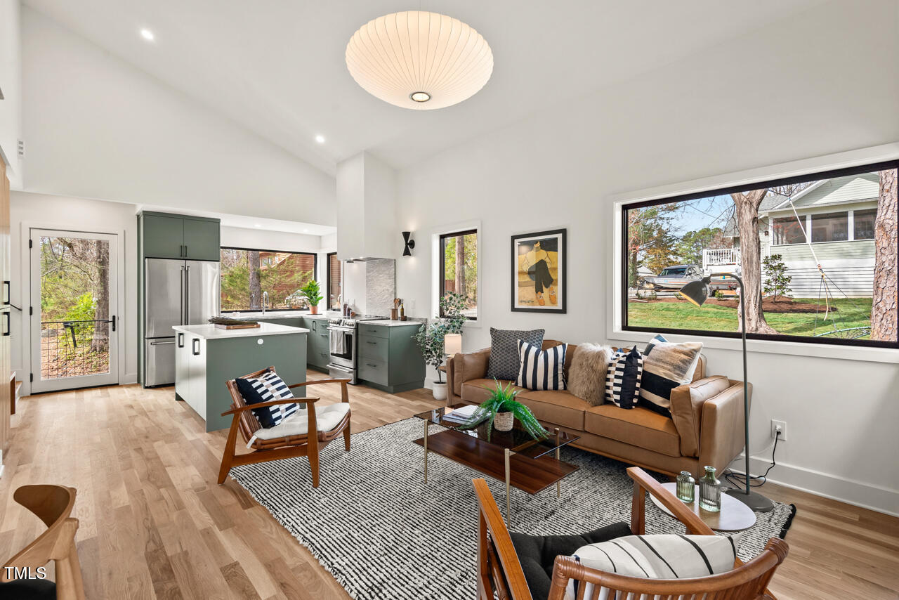 1407 Carroll Street Durham, NC 27707 - Photo 6 of 48 a living room with furniture and a flat screen tv