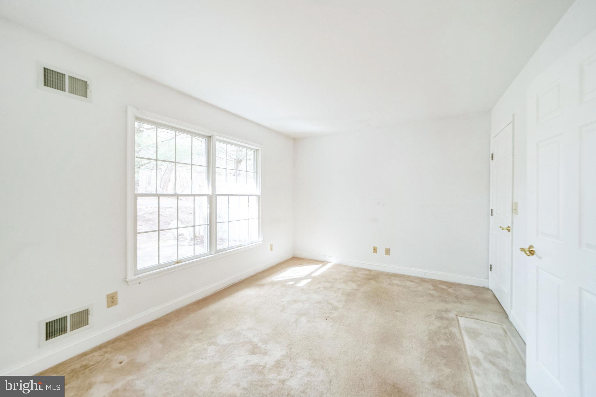 45 Hedge Row Road Princeton, NJ 08540 - Photo 17 of 24 an empty room with a window
