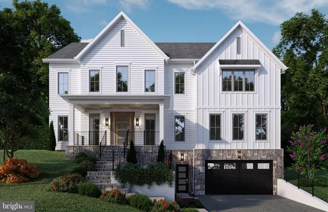 a view of house with garden and tall trees