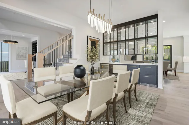 a dining room with furniture a chandelier and wooden floor