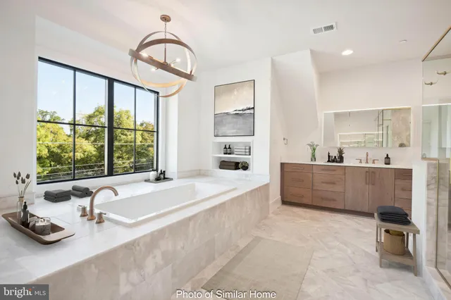 a bathroom with a sink mirror toilet and shower