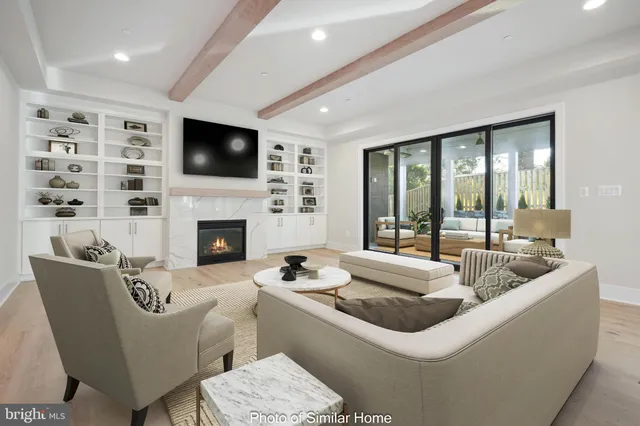 a living room with furniture fireplace and flat screen tv