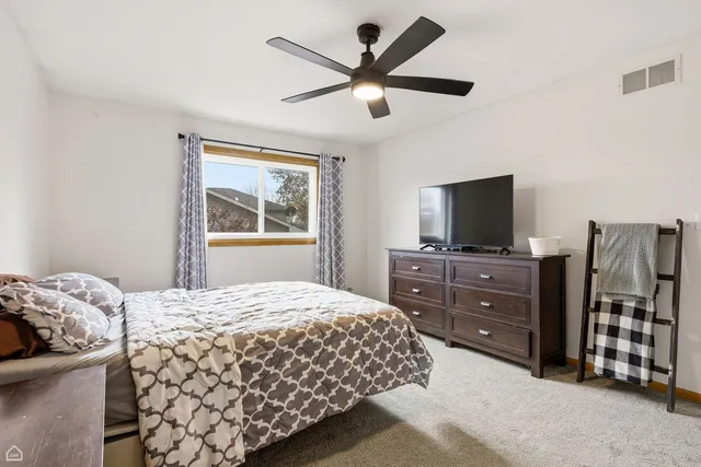 a bedroom with a bed and a closet