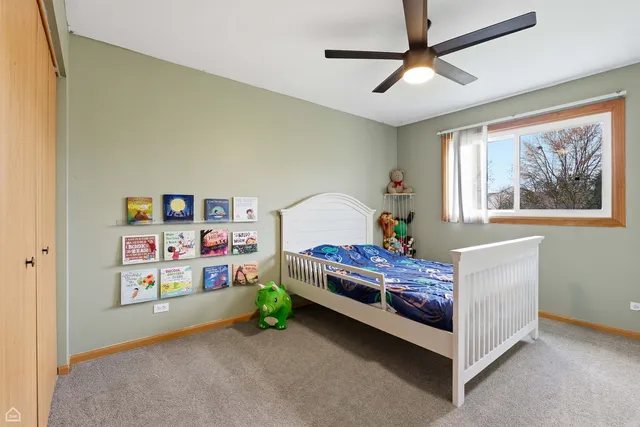 a bedroom with furniture and a window