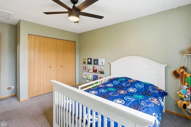 a view of a room with furniture window and ceiling fan