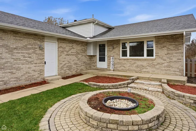 front view of a house with a garden