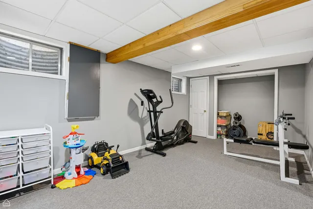 a utility room with cabinets dryer and washer