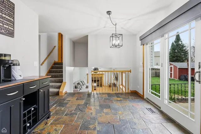 a view of a hallway with wooden floor and entryway
