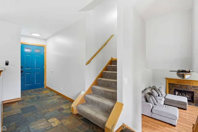 a view of entryway and hall with wooden floor