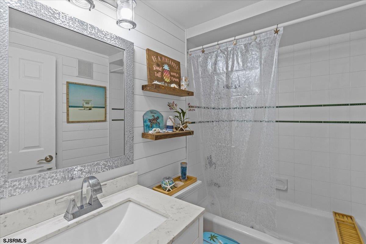 331 41st Street South, Unit 1 Brigantine, NJ 08203 - Photo 18 of 42 a bathroom with a sink and a bathtub