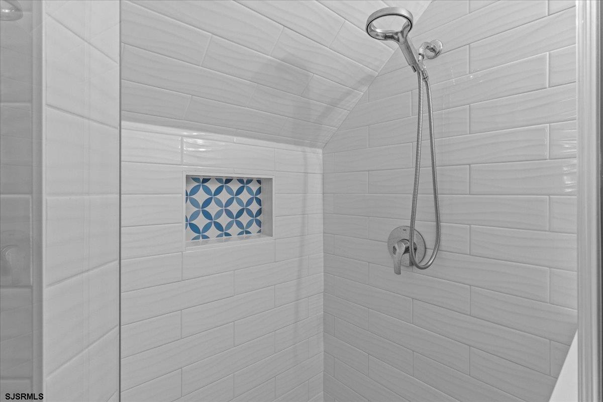 331 41st Street South, Unit 1 Brigantine, NJ 08203 - Photo 23 of 42 a bathroom with a shower and a shower
