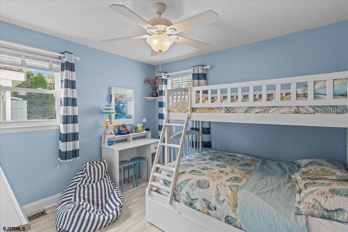 331 41st Street South, Unit 1 Brigantine, NJ 08203 - Photo 24 of 42 a bedroom with furniture and a window