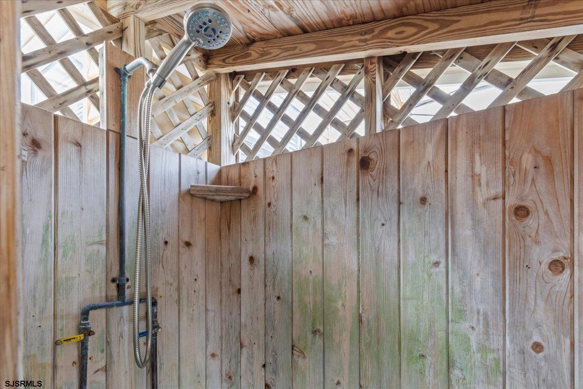 331 41st Street South, Unit 1 Brigantine, NJ 08203 - Photo 31 of 42 a bathroom with a shower and a glass door
