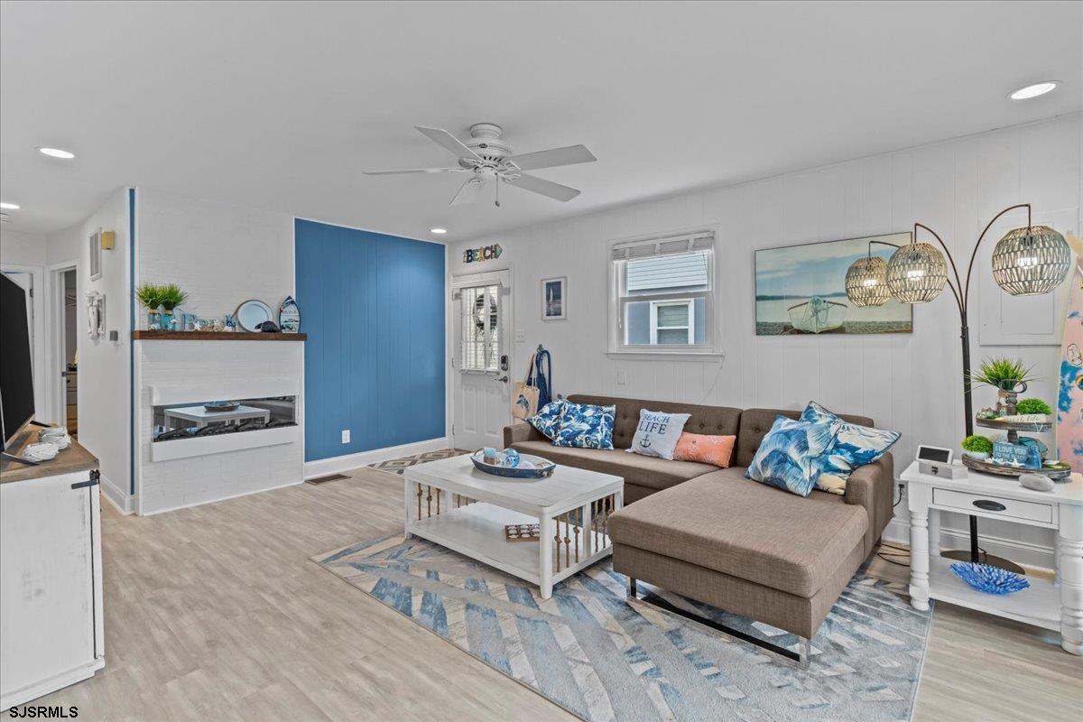 331 41st Street South, Unit 1 Brigantine, NJ 08203 - Photo 9 of 42 a living room with furniture and wooden floor
