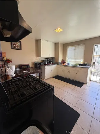 a kitchen with a stove and a refrigerator