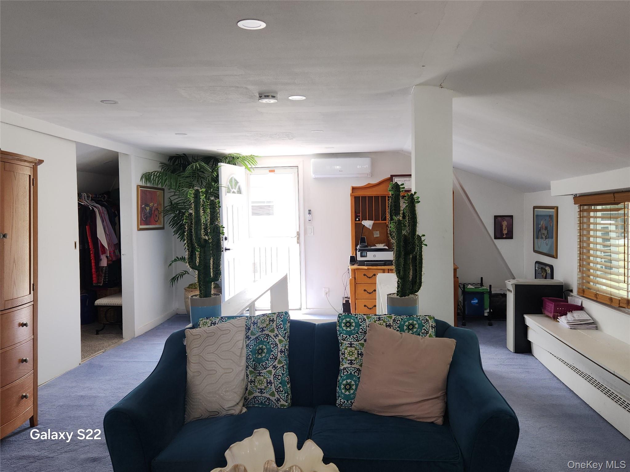 46 Randolph Road White Plains, NY 10607 - Photo 13 of 16 Living room featuring a wall mounted air conditioner, carpet flooring, recessed lighting, and vaulted ceiling