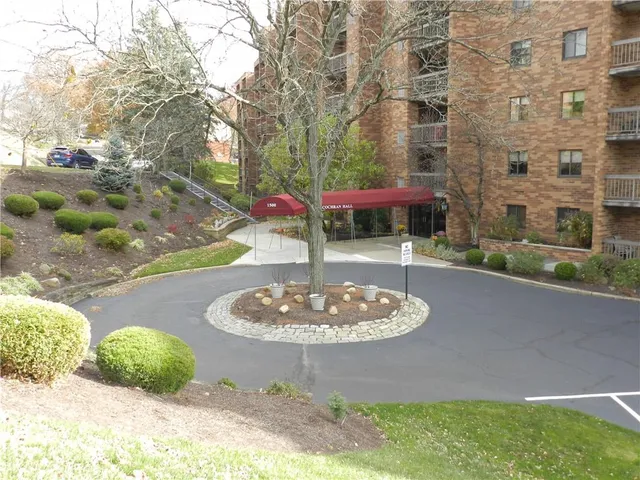 a swimming pool with outdoor seating and yard