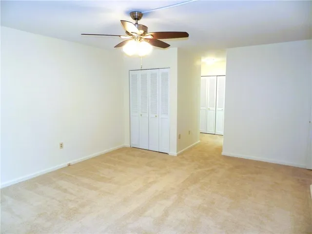 a view of a balcony with yard