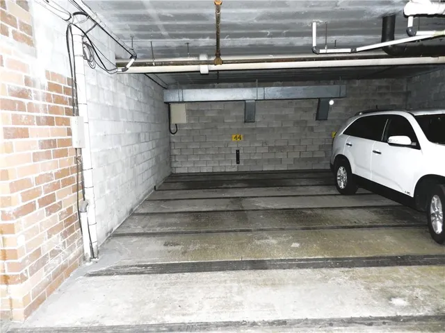a view of a house with a yard and garage