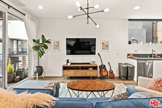 a room with furniture and a flat screen tv