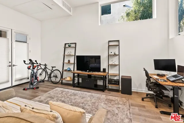a view of a livingroom with furniture and a flat screen tv