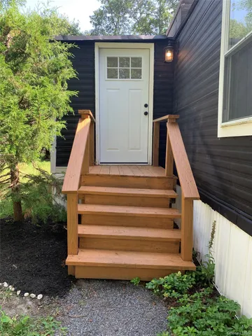 a view of backyard with small cabin