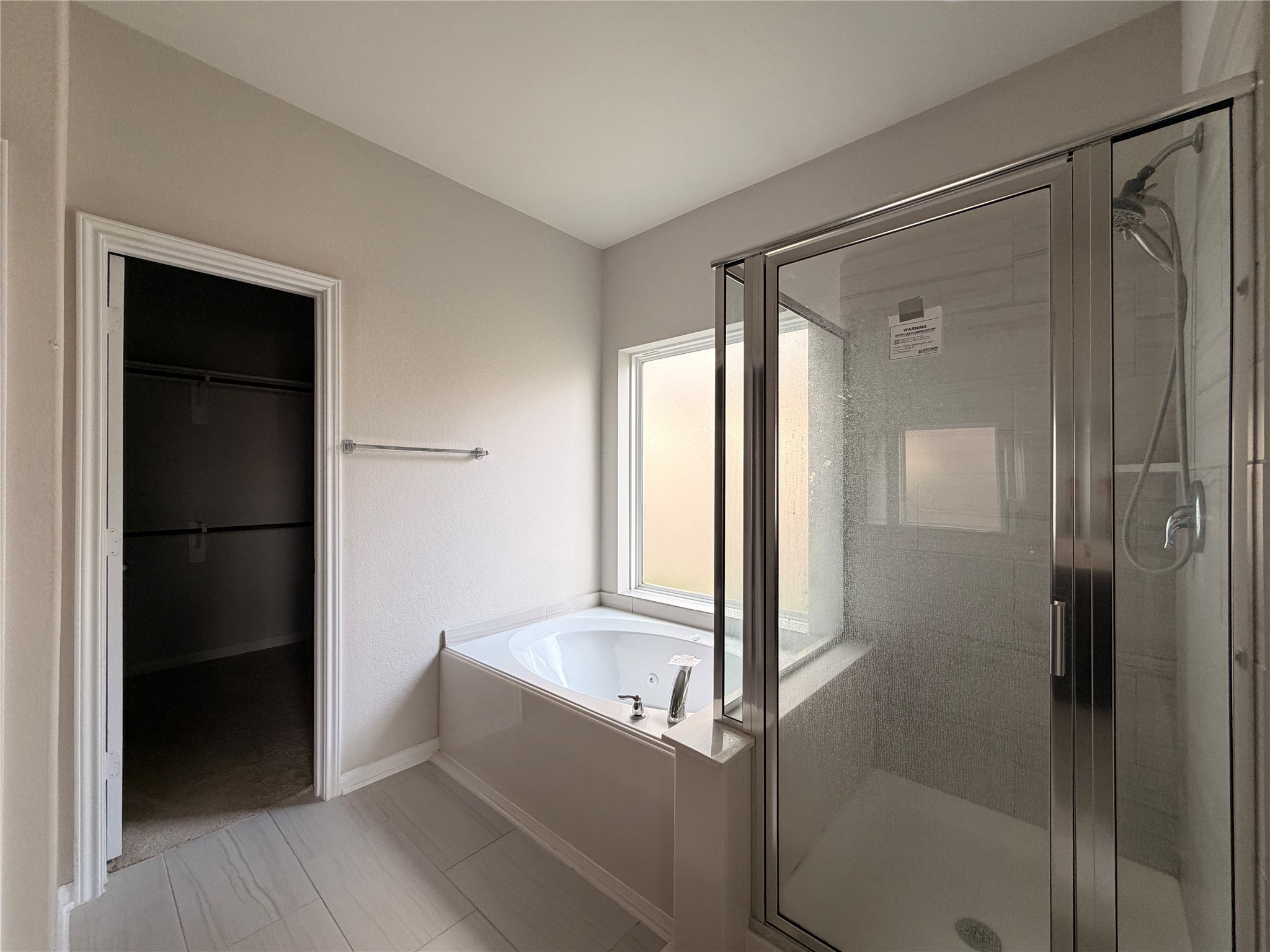 4307 Wyanngate Drive Spring, TX 77373 - Photo 8 of 21 a bathroom with a bathtub and a shower