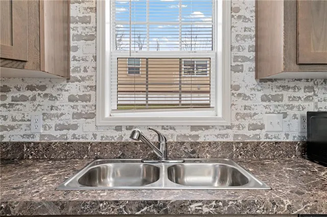 a kitchen with a stove microwave and cabinets