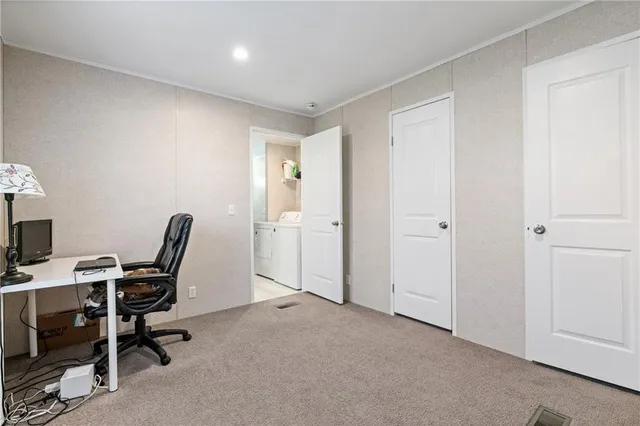 a view of a workspace with furniture