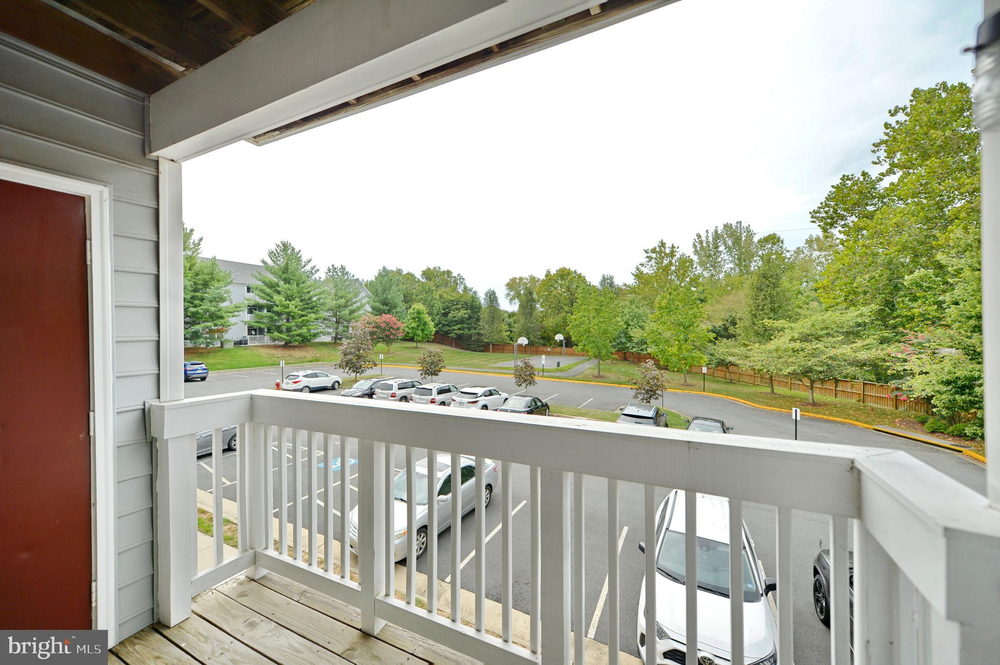 511 Constellation Square Southeast, Unit E Leesburg, VA 20175 - Photo 12 of 34 Balcony View of Basketball Court & Woods