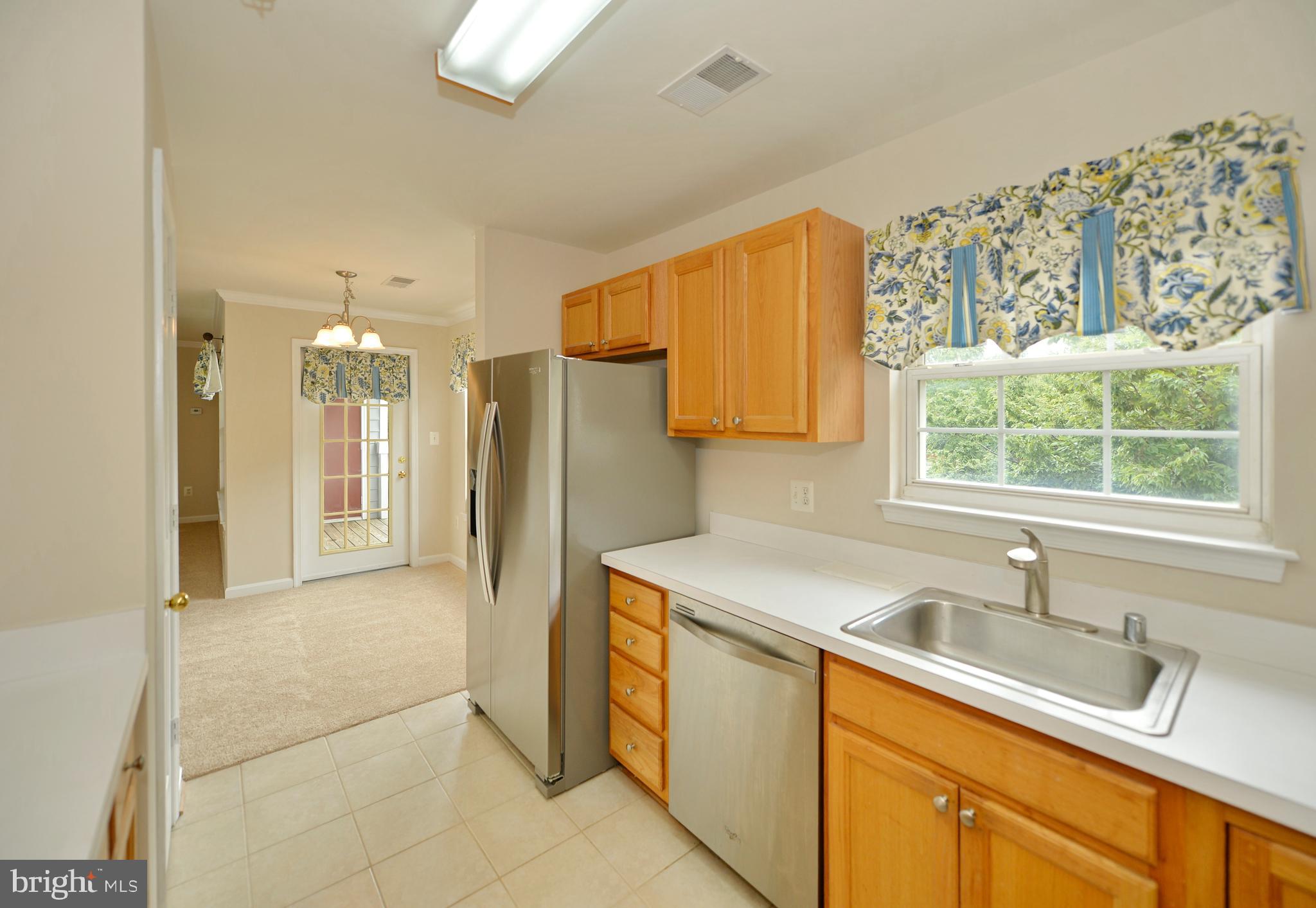 511 Constellation Square Southeast, Unit E Leesburg, VA 20175 - Photo 15 of 34 Kitchen view to Dining Room